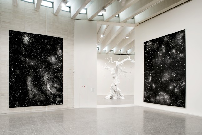 Installation view of sculpture and painting by Ugo Rondinone