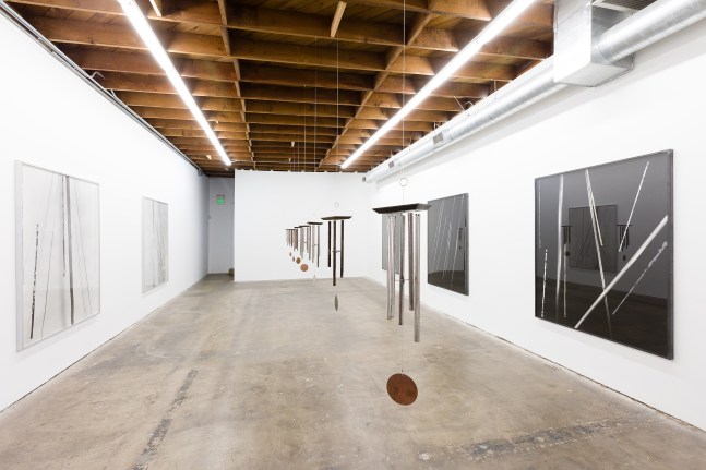 Installation view of paintings and sculptures by Sam Falls