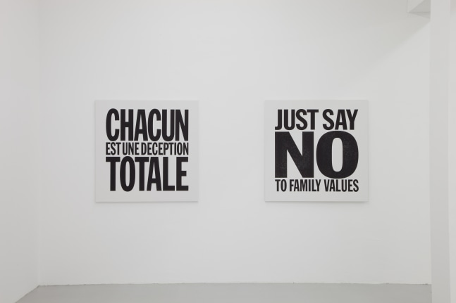 Installation view of wall works by John Giorno