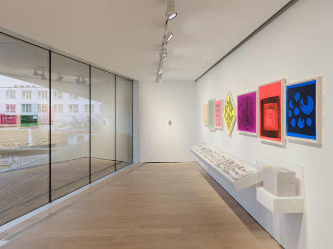 Installation view of sculptures, screen prints, paintings and drawings by Steven Shearer