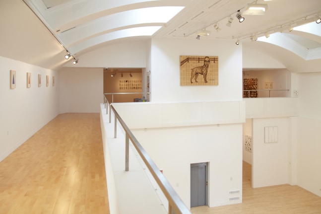 Installation view of works by Tim Rollins and K.O.S.