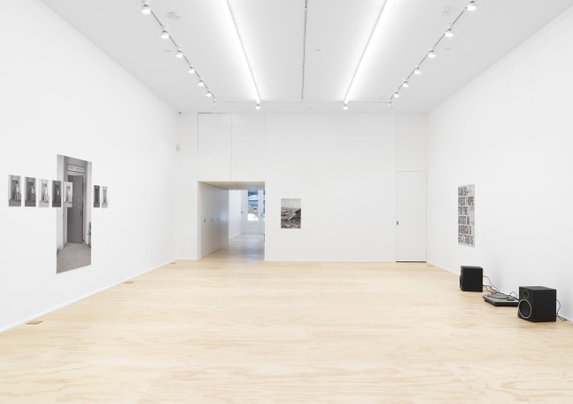 Installation view of photographs by Shannon Ebner