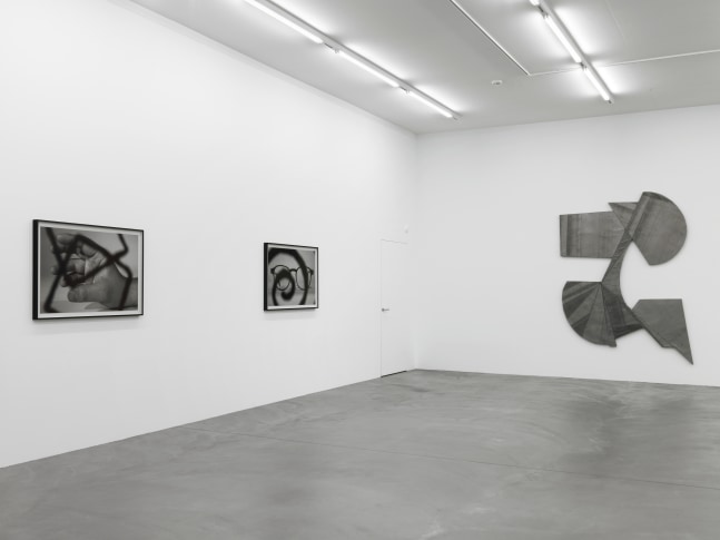 Installation view of Wyatt Kahn wall reliefs and photographs