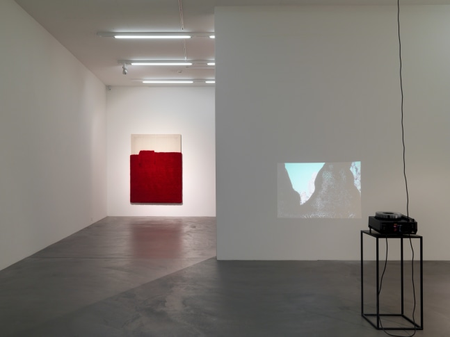 Installation view of paintings, video works and wall works by Latifa Echakhch