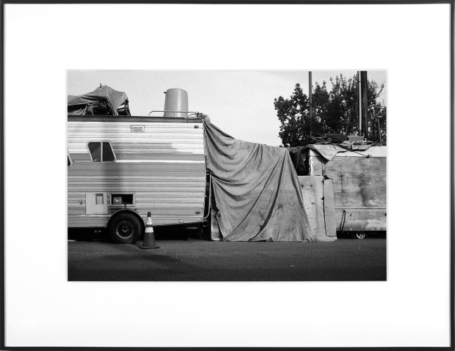 (Temporary) Homes for America: 3300 block to 4400 block, Union Pacific Avenue, between South Grande Vista Avenue and South Marianna Avenue, Los Angeles/Commerce, California, December 2020
2021
Black and white fiber print
Ed. 1/1 + 1 AP
Sheet 20.5 x 30.5 cm / 8 x 12 inches

BESHT48017
