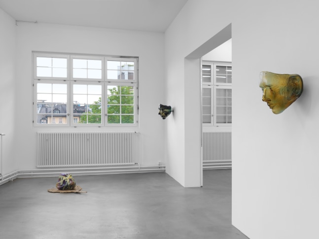 Installation view of group painting, photography, and sculpture exhibition