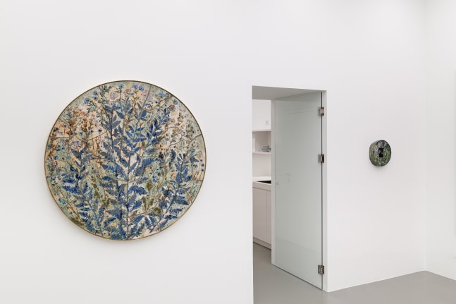 installation views of paintings and ceramic works by Sam Falls