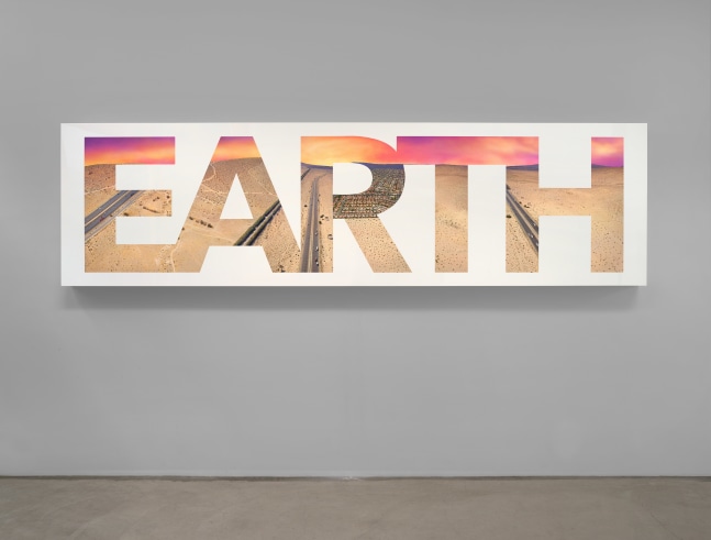 Lightbox with wording EARTH by Doug Aitken
