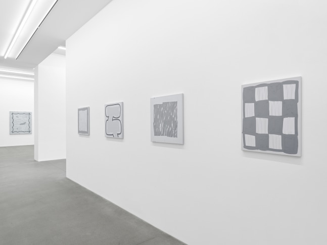 installation view of grayscale paintings by Amy Feldman