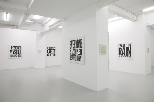 Installation view of wall works by John Giorno