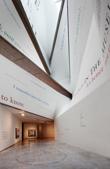 Installation view of wall quotes by Douglas Gordon