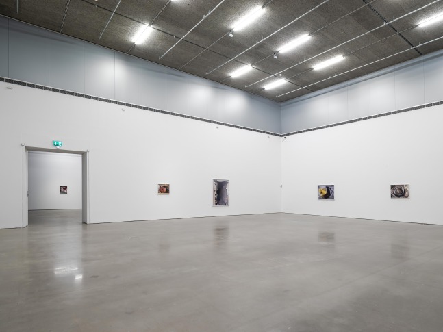 Installation view of photographs by Torbjørn Rødland