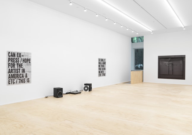 Installation view of photographs by Shannon Ebner