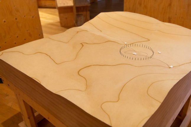 Installation view of living art installation by Oscar Tuazon