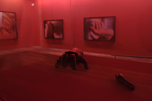 Installation view of photographs and sculptures by Douglas Gordon