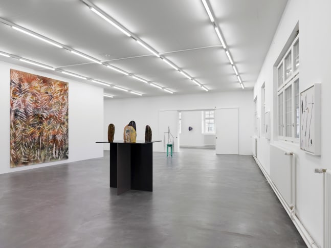 Installation view of group painting, photography, and sculpture exhibition