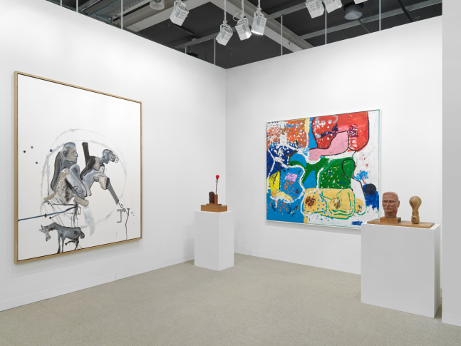 installation view of paintings and sculptures by various artists