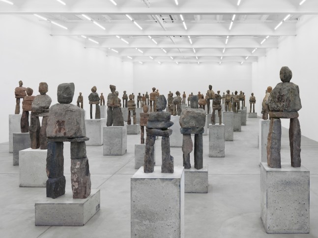 Installation view of Ugo Rondinone stone figure sculptures
