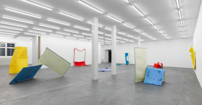 Installation view of Alex Hubbard sculptural paintings and film exhibition