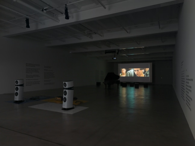 Installation view of Liam Gillick audio and film installation exhibition