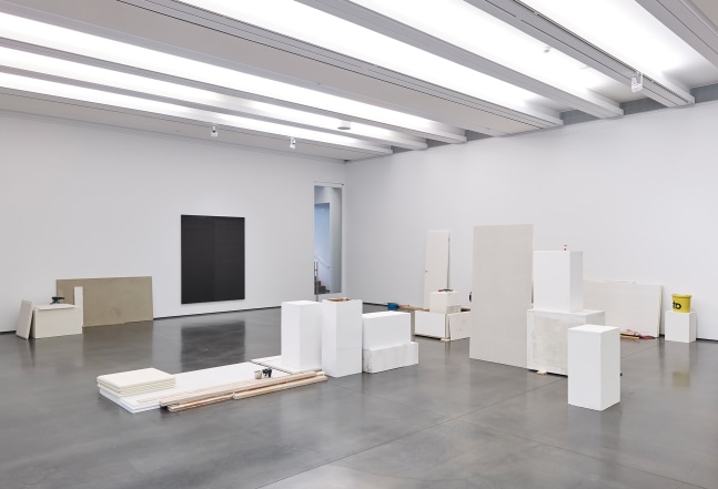 Installation view of sculptures by Peter Fischli and David Weiss and works by Wade Guyton
