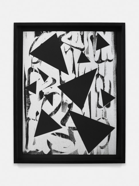 black and white collage of triangle and round shapes on paper