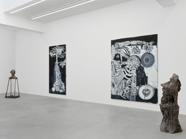 Installation view of group painting, print, and sculpture exhibition