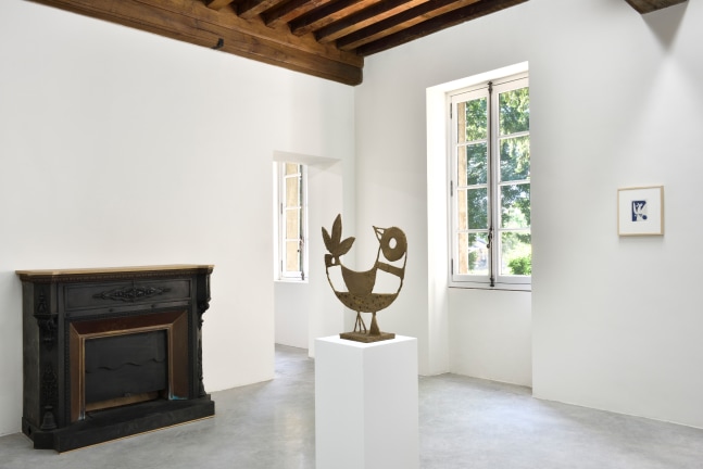 Installation view of paintings and sculptures by Austin Eddy