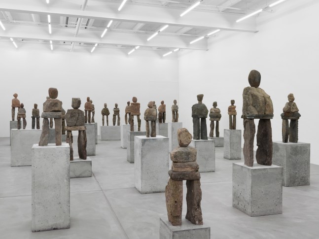 Installation view of Ugo Rondinone stone figure sculptures