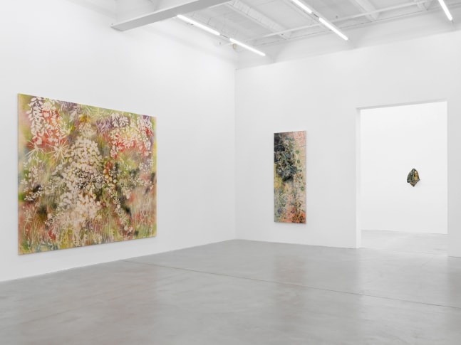 Installation view of Sam Falls paintings and ceramic reliefs exhibition