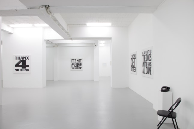 Installation view of wall works by John Giorno