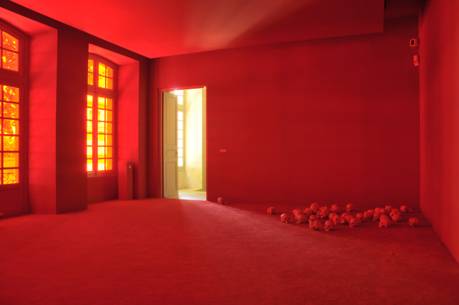 Installation view of photographs and sculptures by Douglas Gordon