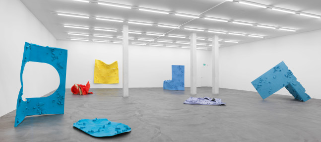 Installation view of Alex Hubbard sculptural paintings and film exhibition