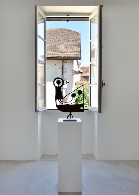 Installation view of paintings and sculptures by Austin Eddy