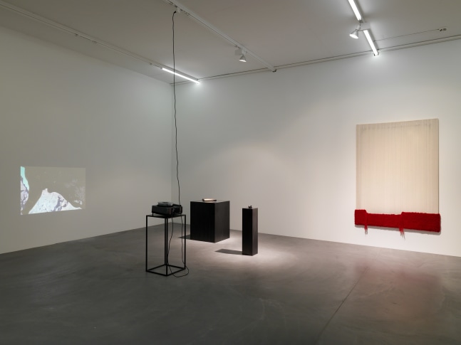 Installation view of paintings, video works and wall works by Latifa Echakhch