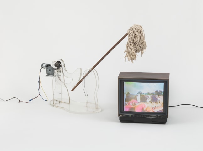 Carolee Schneemann
War Mop, 1983
plexiglass construction, mop, motor, video monitor
Sculpture: 24 x 62 x 20 inches; TV: 12 x 18 x 10 inches