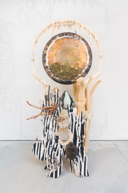 Guadalupe Maravilla
Disease Thrower #3, 2019
gong, steel, wood, cotton, glue mixture, plastic, loofah, and objects collected from a ritual of retracing the artist&amp;#39;s original migration route
96 x 57 x 63 ins.
243.8 x 144.8 x 160 cm