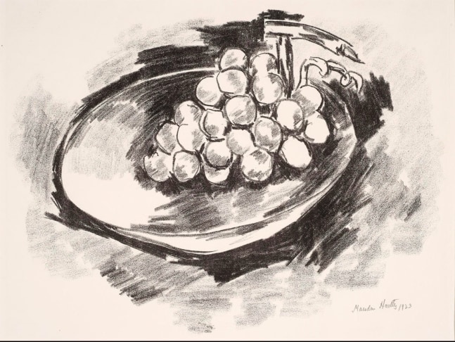 a lithograph of grapes in a bowl tilting forward to the left of the paper