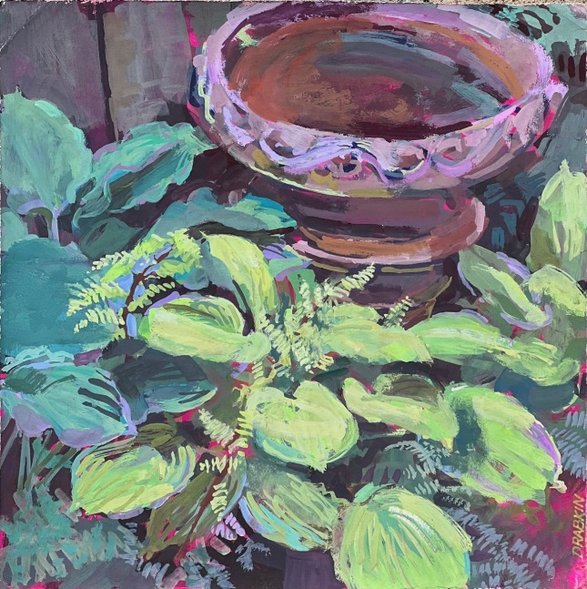 close up of hosta plants and a planter on a brick floor