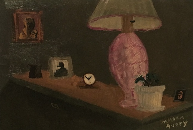a small dark still ife on an angled table with a clock and a pink lamp
