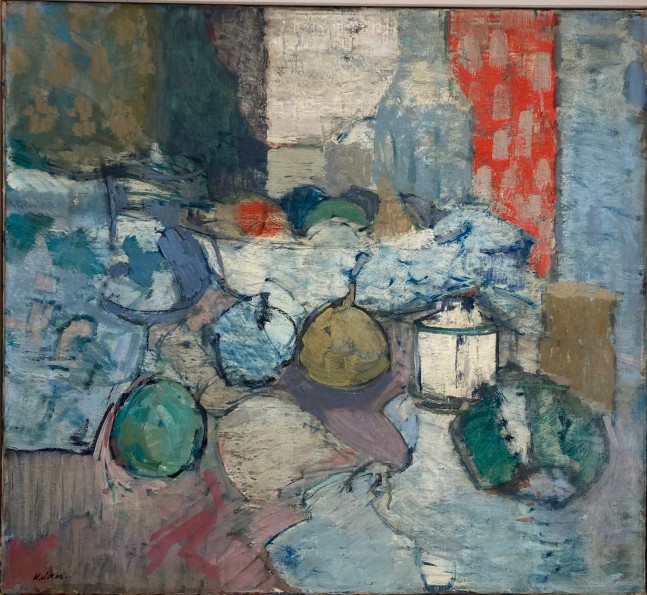 painterly still life with lots of objects on a table including a bowl of fruit