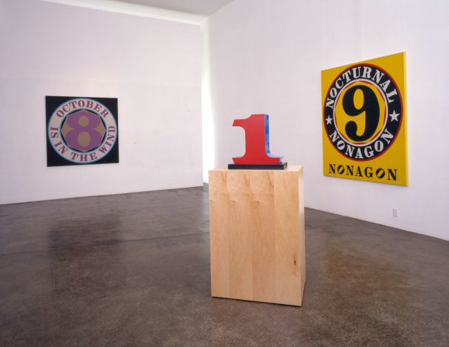 Installation view, Robert Indiana: New Paintings and Sculptures, Michael Kohn Gallery, Los Angeles, September 19&amp;ndash;October 25, 2003. Left to right, October Is in the Wind (2000), ONE (1978&amp;ndash;2003), and Nocturnal Nonagon (2001)