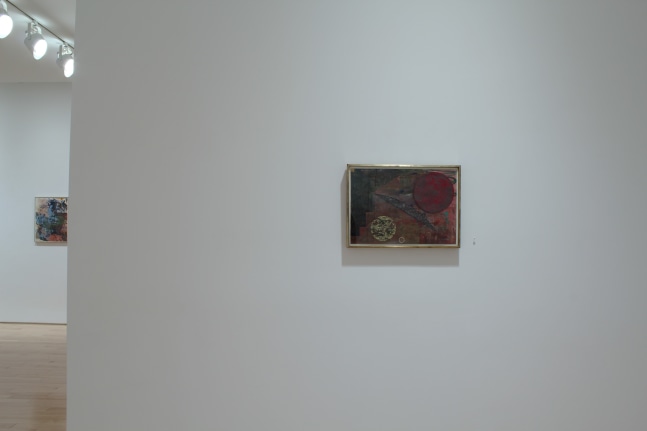 Photograph of a view of an exhibition space, showing two small paintings hung on white walls
