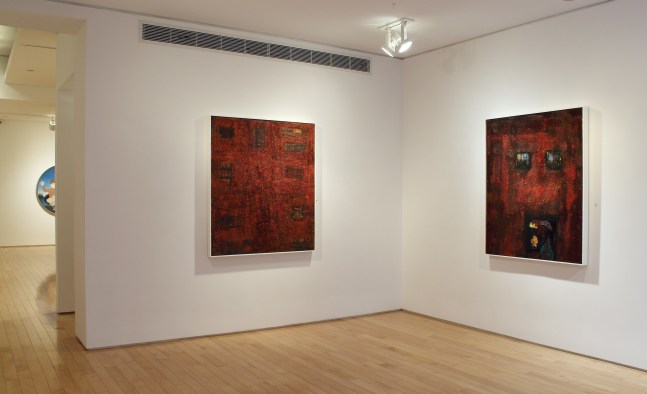 Photograph showing a corner view of an exhibition space, with two paintings hung on white walls