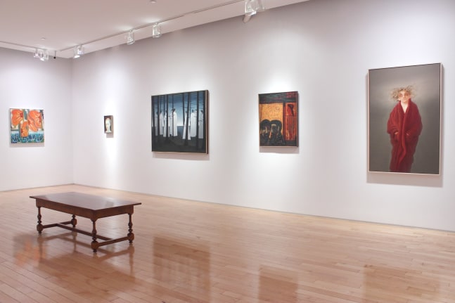 Photograph showing a corner view of an exhibition space, with five paintings hanging on white walls