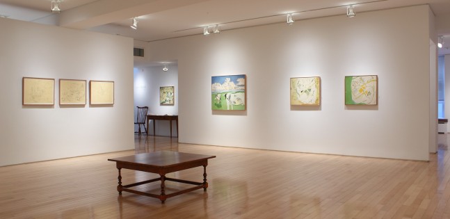 Photograph showing a corner view of an exhibition space, with three paintings and three framed drawings hanging on white walls