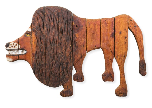 Wooden sculpture of an abstracted lion