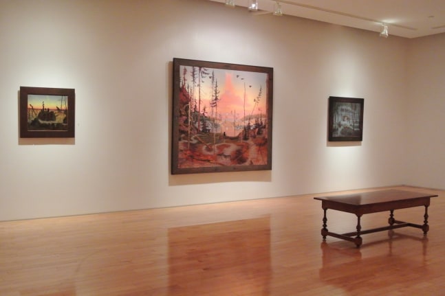 Photograph showing a view of an exhibition space, with one large framed paintings and two smaller framed paintings hanging on a white wall