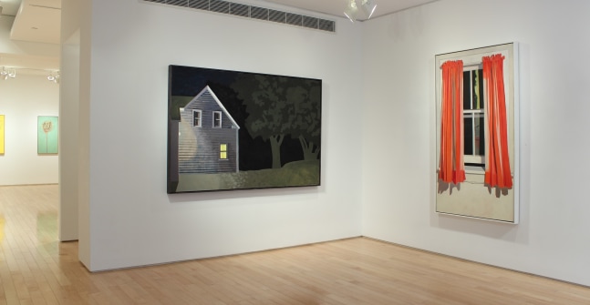 Photograph showing a view of an exhibition space, with two paintings hanging on white walls