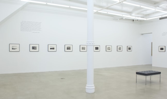 Photograph of ten framed drawings in a white gallery exhibition space